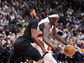 Pascal Siakam of the Toronto Raptors makes a move against Darius Garland of the Cleveland Cavaliers during the second half of their basketball game at the Scotiabank Arena on November 28, 2022 in Toronto, Ontario, Canada.