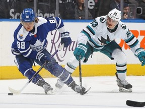 Matt Nieto of the San Jose Sharks skates to check William Nylander of the Toronto Maple Leafs during an NHL game at Scotiabank Arena on November 30, 2022 in Toronto, Ontario, Canada.
