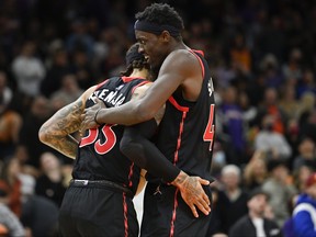 Gary Trent Jr. #33 and Pascal Siakam #43 of the Toronto Raptors celebrate after defeating the Phoenix Suns 117-112 at Footprint Center on March 11, 2022 in Phoenix, Arizona. (Photo by Kelsey Grant/Getty Images)