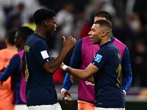 France's Kylian Mbappe (right) celebrates with  midfielder Aurelien Tchouameni.