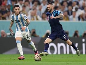 Marcelo Brozovic of Croatia in action with Enzo Fernandez of Argentina during the FIFA World Cup Qatar 2022 semi final match between France and Morocco at Al Bayt Stadium on December 14, 2022 in Al Khor, Qatar.