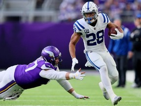 Jonathan Taylor of the Indianapolis Colts carries the ball against the Minnesota Vikings during the first quarter at U.S. Bank Stadium on December 17, 2022 in Minneapolis, Minnesota.
