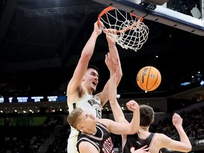 Toronto's Zach Edey #15 of the Purdue Boilermakers shoots the ball against the Davidson Wildcats at Gainbridge Fieldhouse on December 17, 2022 in Indianapolis.