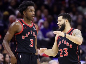 O.G. Anunoby #3 and Fred VanVleet #23 of the Toronto Raptors speak during the third quarter at Wells Fargo Center on December 19, 2022 in Philadelphia.