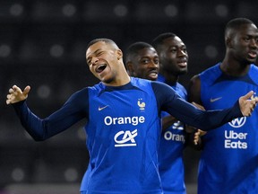 France forward Kylian Mbappe reacts during a training session.