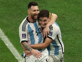 Argentina forward Julian Alvarez (right) celebrates with Lionel Messi after scoring his team's second goal.