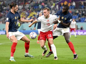 France's Adrien Rabiot (left) and Dayot Upamecano, seen here playing against Denmark, missed the semifinal with an illness.