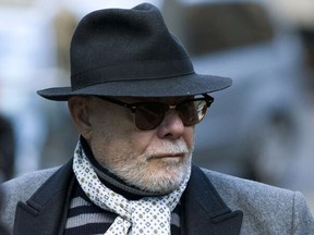 British former pop star Gary Glitter, whose real name is Paul Gadd, arrives at Southwark Crown Court in central London in 2015.