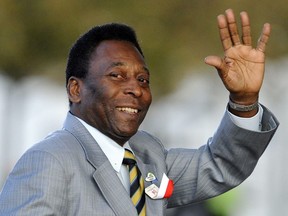 In this file photo taken on October 01, 2009, Brazilian former footballer Pele waves as he arrives for the opening ceremony of the 121st session of the International Olympic Congress in Copenhagen.
