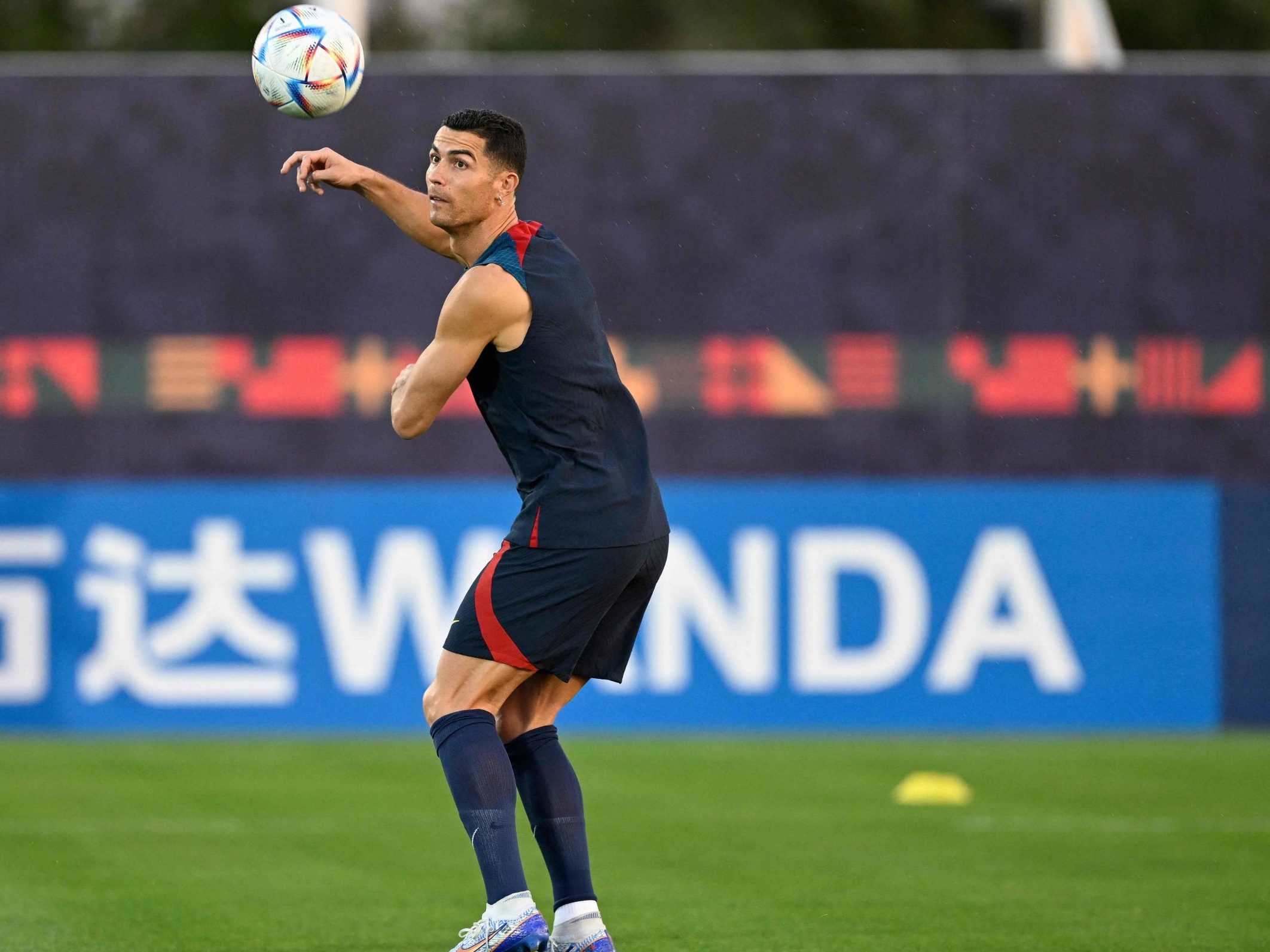 Portugal's Cristiano Ronaldo heads the ball during a team training