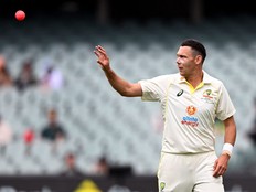 Australia's Scott Boland catches the ball during the fourth day of the second cricket Test match between Australia and the West Indies at the Adelaide Oval in Adelaide on December 11, 2022.