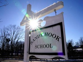 A sign for Sandy Hook Elementary School in Newtown, Conn., on Dec. 13, 2022.