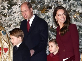 Prince William, Prince of Wales (rear L) and his wife Catherine, Princess of Wales (2nd R) arrive with their children Princess Charlotte of Wales and Prince George of Wales, to attend the "Together At Christmas Carol Service" at Westminster Abbey, in London, on December 15, 2022.
