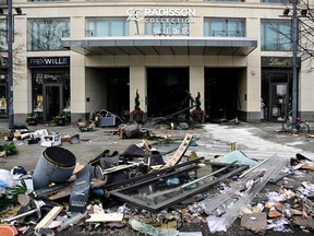 Debris lies in front of the Radisson Blu hotel, where a huge aquarium located in the hotel's lobby burst on December 16, 2022 in Berlin.