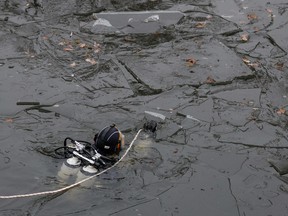 A police diver searches on December 25, 2022 the Landwehr Canal in Berlin, in connection with the stolen jewels of the Green Vault in Dresden.