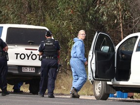 Police work near the scene of a fatal shooting, where police shot multiple people at a remote Queensland property after an ambush in which two officers  were also killed, in Wieambilla, Australia, December 13, 2022.