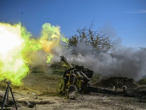An Armenian soldier fires artillery on the front line on October 25, 2020, during the ongoing fighting between Armenian and Azerbaijani forces over the breakaway region of Nagorno-Karabakh.