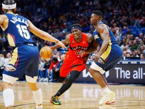Toronto Raptors forward Pascal Siakam  drives to the basket against New Orleans Pelicans forward Zion Williamson during the first quarter at Smoothie King Center.