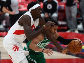Boston Celtics guard Tremont Waters steals the ball from Toronto Raptors forward Pascal Siakam during the first quarter at Amalie Arena.