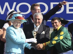 Queen Elizabeth II attends the 151 Queen's Plate at Woodbine Race Track in Toronto, July 4, 2010. Horse Big Red Mike (Jockey Eurico Rosa Da Silva) owned by Terra Racing Stable, trained by Nicholas Gonzalez won the race.