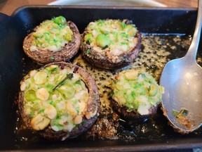 Stuffed mushroom caps with prawn mussolini, miso butter, and wasabi peas, served at Brazen restaurant in Banff, Alta.