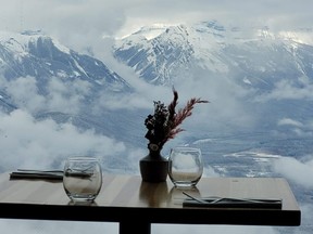 A table next to a window at Sky Bistro in Banff, Alta.