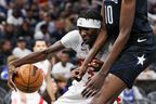 Raptors forward Chris Boucher runs into Orlando Magic centre Bol Bol on Sunday, Dec. 11.