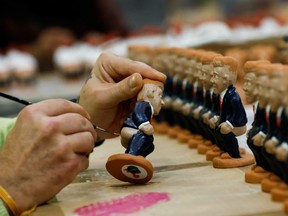 Catalan traditional figurines "caganers" made in clay representing Rishi Sunak are painted by inmates of Puig de les Basses Penitentiary Center in Figueres, north of Barcelona, Spain, December 13, 2022.