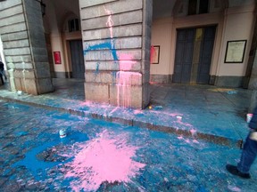 The entrance of Milan's famed La Scala opera house is seen splattered with paint after ''Ultima Generazione'' (Last Generation) climate activist threw paint during an action ahead of the first performance of the season, in Milan, Italy, December 7, 2022.