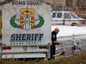 A member of the Adams County Sheriff's office works near the scene of a shooting at a Jehovah's Witnesses Kingdom Hall in Thornton, Colorado, December 25, 2022.