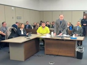 Anderson Lee Aldrich, 22, the suspect in the mass shooting that killed five people and wounded 17 at an LGBTQ nightclub appears seated before a judge during his charging hearing in Colorado Springs, Colorado, Dec. 6, 2022 in a still image from livestream video.