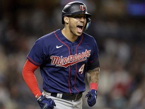 Minnesota Twins' Carlos Correa reacts after hitting a two-run home run against the New York Yankees during the eighth inning of a baseball game Thursday, Sept. 8, 2022, in New York.