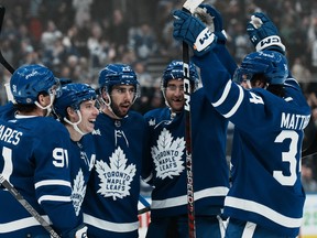 Maple Leafs' Mitchell Marner (second from left) celebrates with teammates after scoring against the Los Angeles Kings during the second period at Scotiabank Arena in Toronto on Thursday, Dec. 8, 2022.