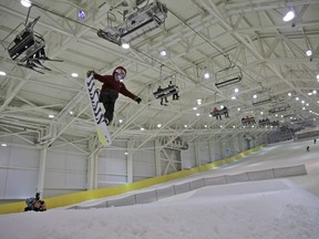 Snowboarders and skiers enjoy the grand opening of Big Snow, Thursday, Dec. 5, 2019, in East Rutherford, N.J. The facility, which is part of the American Dream mega-mall, is North America's first indoor ski and snowboard facility with real snow.