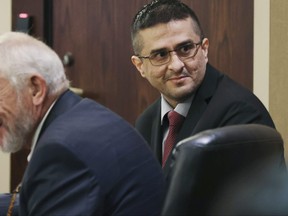 Capital murder defendant and former U.S. Border Patrol Juan David Ortiz looks around the courtroom before the start of the first day of the trial before Webb County State District Court Judge Oscar J. Hale, Monday, Nov. 28, 2022.