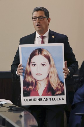 During opening statements, Webb County District Attorney Isidro R. “Chilo” Alaniz shows photographs of a victim during the capital murder trial of former U.S. Border Patrol supervisor Juan David Ortiz before Webb County State District Court Judge Oscar J. Hale, Monday, Nov. 28, 2022.
