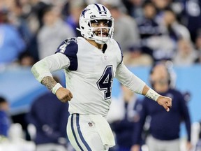 Cowboys quarterback Dak Prescott celebrates a touchdown against the Titans during fourth quarter NFL action at Nissan Stadium in Nashville, Thursday, Dec. 29, 2022.
