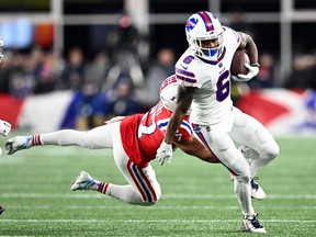 Buffalo Bills wide receiver Isaiah McKenzie (6) rushes past New England Patriots cornerback Myles Bryant (27) at Gillette Stadium.
