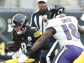 Pittsburgh Steelers quarterback Kenny Pickett is sacked by  Baltimore Ravens linebacker Roquan Smith during the first quarter at Acrisure Stadium. Baltimore won 16-14.