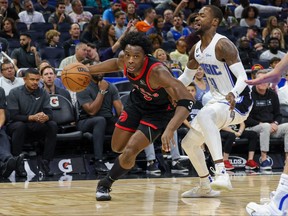 Toronto Raptors forward O.G. Anunoby (3) drives to the basket against Orlando Magic guard Terrence Ross (31).