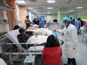 A medical worker attends to a patient at the emergency department of Ganyu District People's Hospital in Lianyungang, China December 28, 2022.