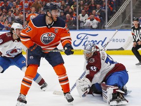 Colorado Avalanche goaltender Darcy Kuemper makes a save on Edmonton Oilers forward Connor McDavid during the third period at Rogers Place.