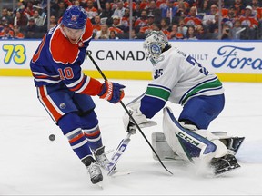 Vancouver Canucks goaltender Thatcher Demko (35) makes a save on Edmonton Oilers forward Derek Ryan (10) during the third period at Rogers Place.