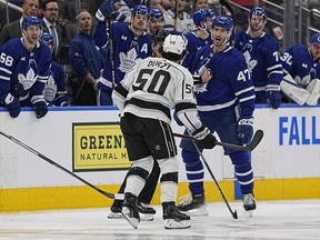 Maple Leafs forward Pierre Engvall and Los Angeles Kings defenseman Sean Durzi exchange words Thursday night after a third-half goal at the Scotiabank Arena.