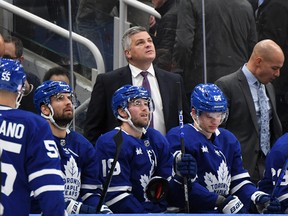 Maple Leafs head coach Sheldon Keefe looks up at the video board during a break in play against the New Jersey Devils at Scotiabank Arena.