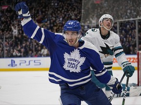Toronto Maple Leafs forward Pierre Engvall reacts after scoring the winning goal as San Jose Sharks defenseman Matt Benning skates away during the third period at Scotiabank Arena.