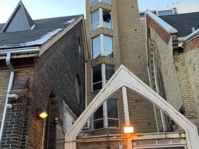 Damage can be seen after a fire at an apartment building run by the All Saints Church at Sherbourne and Dundas Sts. on Tuesday, Dec. 13, 2022.