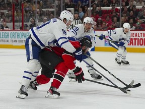 Carolina Hurricanes right wing Stefan Noesen (23) tries to carry the puck past Toronto Maple Leafs centre Calle Jarnkrok (19) and defenceman TJ Brodie (78) during the first period at PNC Arena on Nov. 6.