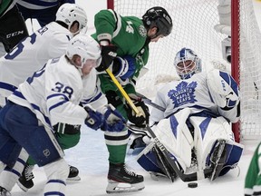 Toronto Maple Leafs goaltender Matt Murray defends against a shot on a power play by Dallas Stars' Jamie Benn (14) as Roope Hintz (24), Rasmus Sandin and Mitchell Marner look on in the second period of an NHL hockey game, Tuesday, Dec. 6, 2022, in Dallas. (AP Photo/Tony Gutierrez)