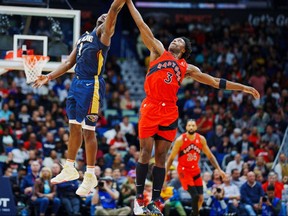 New Orleans Pelicans forward Zion Williamson (1) jumps for the ball against Toronto Raptors forward O.G. Anunoby (3).